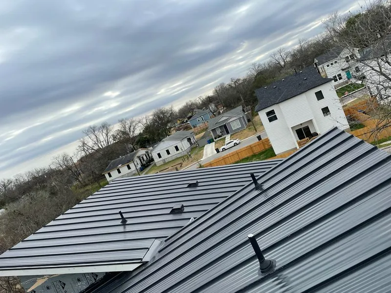 Standing seam metal roof panels with vents for Skylight Repair in Grosse Pointe Park